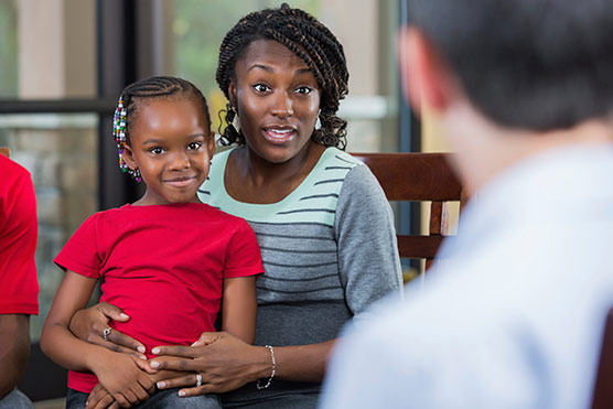 stock-photo-34813364-mother-and-daughter-talking-with-counselor-during-family-counseling-session.jpg